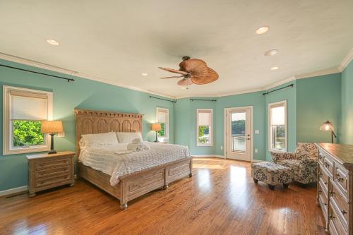 a bedroom with a bed and a ceiling fan at Paradise at Sunset Cove in Moneta