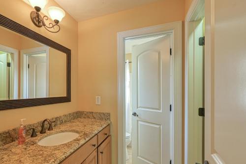 a bathroom with a sink and a mirror at Paradise at Sunset Cove in Moneta