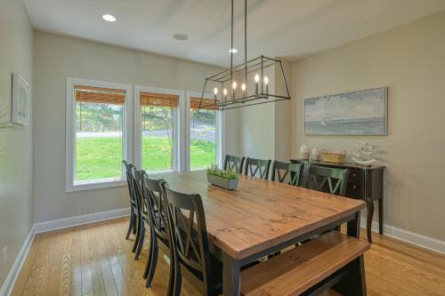 a dining room with a wooden table and chairs at Emerald Cove in Moneta