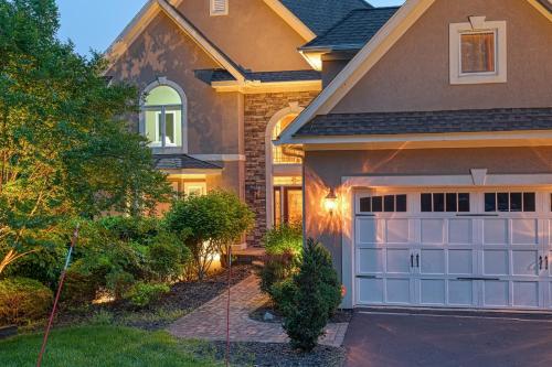 a house with a garage door and a driveway at Paradise at Sunset Cove in Moneta