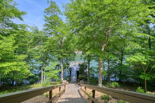 a walkway leading to a gate in a park with trees at Emerald Cove in Moneta