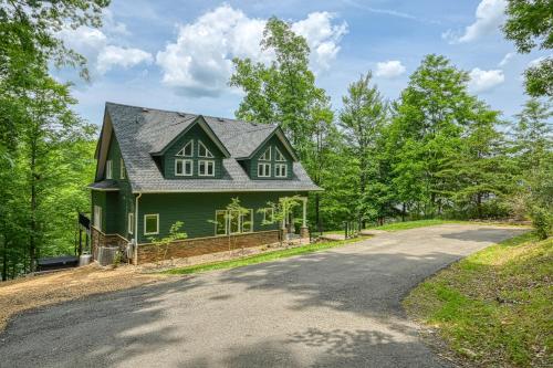 a green house on the side of a road at Emerald Cove in Moneta