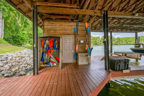 a cabin on a boat on a body of water at Still Waters in Moneta