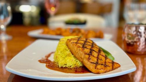 a white plate with a piece of food on a table at Crowne Plaza Cleveland at Playhouse Square by IHG in Cleveland