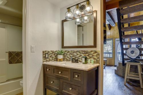 a bathroom with a sink and a mirror at Brian Head Condo Walk to Giant Steps Ski Lifts! in Brian Head