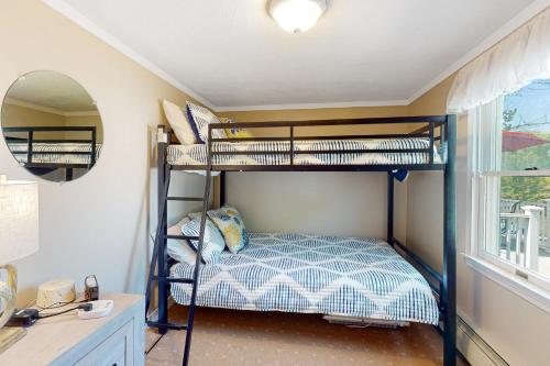 a bedroom with two bunk beds in a room at Sunset Cove Retreat in Wareham