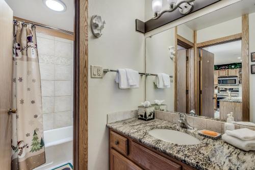 a bathroom with a sink and a mirror at Laurelwood Condominiums 109 in Snowmass Village