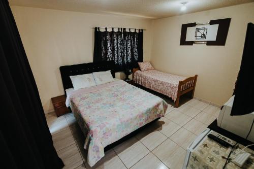 Ένα ή περισσότερα κρεβάτια σε δωμάτιο στο RECANTO DA SERRA