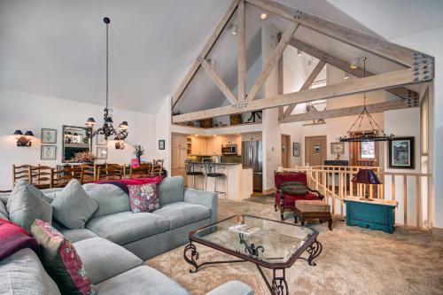 a living room with a couch and a table at The Pines Lodge, a RockResort, by Vail Resorts in Beaver Creek