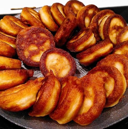 a pile of pretzels and donuts on a plate at Le Domaine de la Férière in Sallen