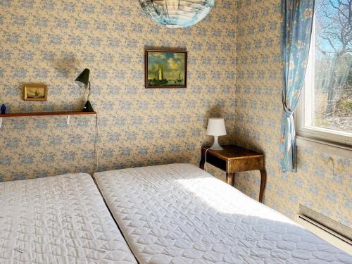 Ένα ή περισσότερα κρεβάτια σε δωμάτιο στο Holiday home DALARÖ II