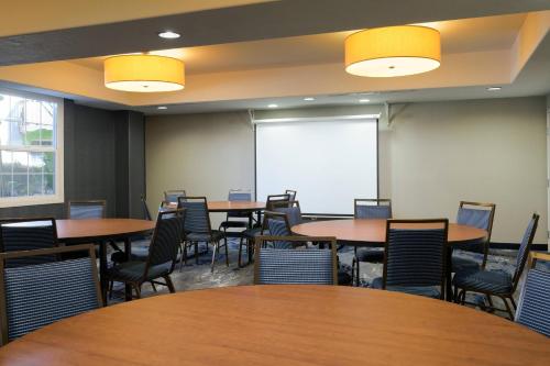 a conference room with tables and chairs and a whiteboard at Fairfield Inn & Suites San Diego Old Town in San Diego