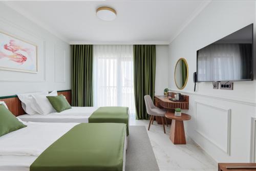 Una cama o camas en una habitación de Hotel Diplomat by Aycon