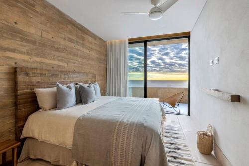 a bedroom with a large bed and a large window at 6 Guests - Amazing Views -Top Design in San José del Cabo