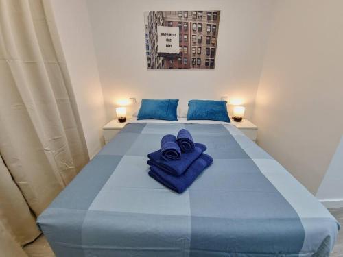 Postel nebo postele na pokoji v ubytování Apartamentos Bielsa 'Madrid Río'