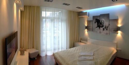 En eller flere senger på et rom på Apartment Mihailovskaya