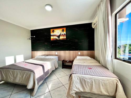 Postel nebo postele na pokoji v ubytování Hotel Fenice