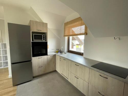 Kuchyň nebo kuchyňský kout v ubytování Apartament letni Almar