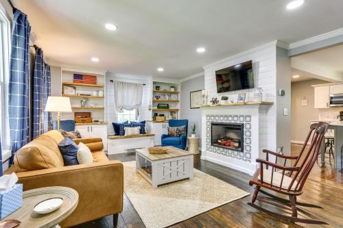 a living room with a couch and a fireplace at Bright Cornwall-On-Hudson Vacation Rental! in Cornwall-on-Hudson
