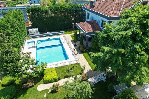 an overhead view of a house with a swimming pool at Heaven White Palace in Bostancı