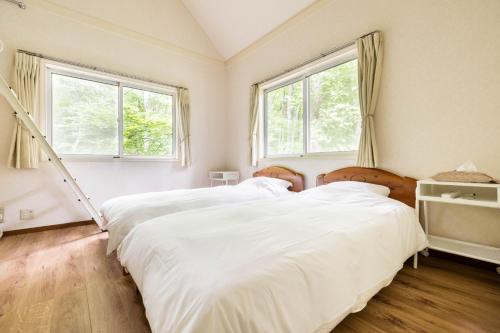 מיטה או מיטות בחדר ב-Green Lodge - Vacation STAY 28389v