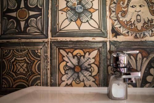 a bathroom with a soap dispenser on top of a sink at Tenuta Valdelmelo in Castiglione della Pescaia