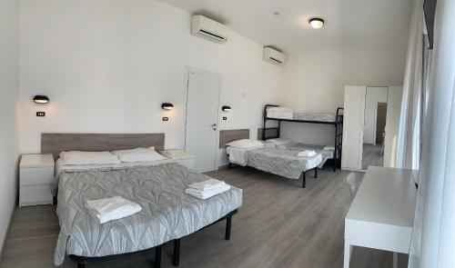Ένα ή περισσότερα κρεβάτια σε δωμάτιο στο Hotel Laika