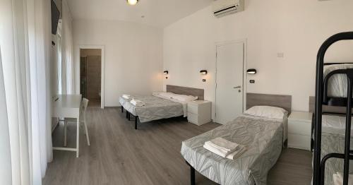 Ένα ή περισσότερα κρεβάτια σε δωμάτιο στο Hotel Laika