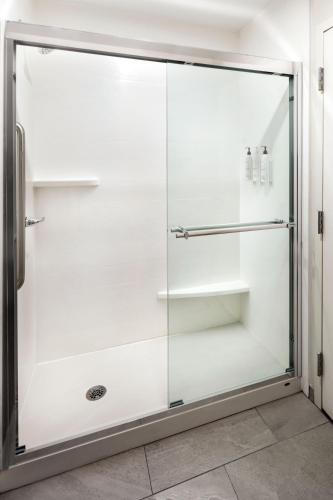 a glass shower stall in a bathroom at Fairfield Inn & Suites by Marriott Jacksonville in Jacksonville