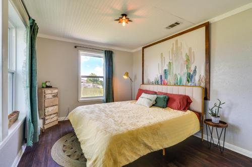 a bedroom with a bed with a painting on the wall at Starlite Ranch 2 Acres with Views about 18 Mi to Waco in Lorena