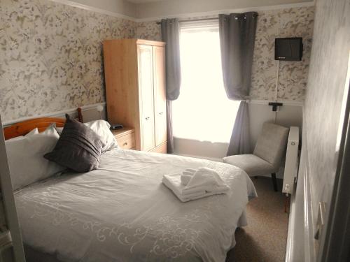 מיטה או מיטות בחדר ב-Hayes Barton