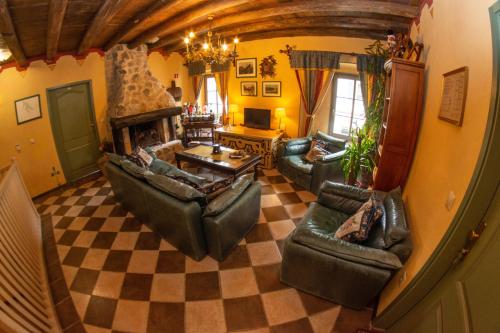 an overhead view of a living room with couches and a fireplace at Apartments Belopeški Dvori in Kranjska Gora