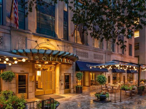 a building with a restaurant on a city street at Sofitel Lafayette Square Washington DC in Washington