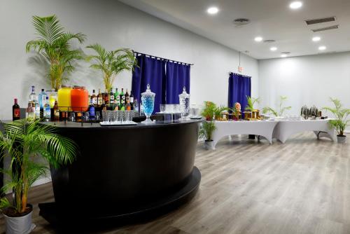 a bar in a room with bottles and drinks at Grand Palladium Jamaica Resort & Spa All Inclusive in Lucea