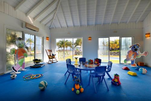 a room with a table and some toys on the floor at Grand Palladium Jamaica Resort & Spa All Inclusive in Lucea
