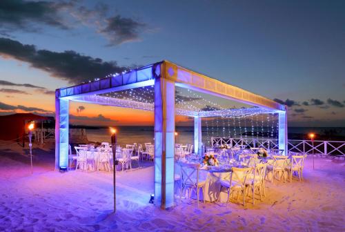 a wedding reception on the beach at night at Grand Palladium Jamaica Resort & Spa All Inclusive in Lucea