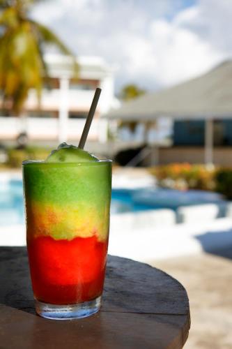 a colorful drink is sitting on a table at Grand Palladium Jamaica Resort & Spa All Inclusive in Lucea