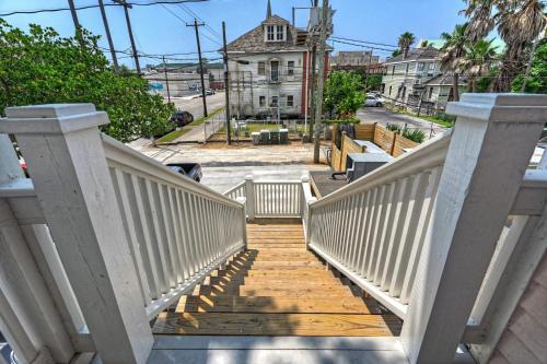 a stairway leading down to a street with a building at Sugar's INN Room #1 in Galveston