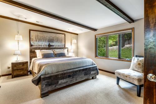 a bedroom with a large bed and a window at Unforgettable Lake Memories in Lake Ozark