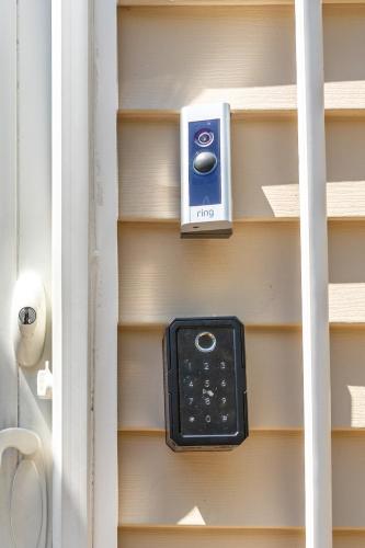 a remote control sitting on a book shelf at Elegance at Huntington Spacious Family Apt Yard in Huntington Station