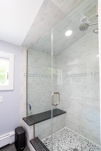 a shower with a glass door in a bathroom at Elegance at Huntington Spacious Family Apt Yard in Huntington Station