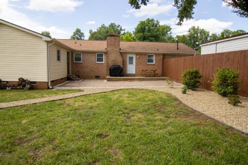 a backyard of a house with a fence at Home Away in Taylors by Brick and Home in Taylors