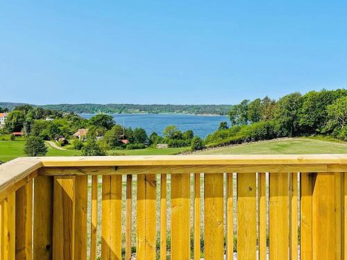 a wooden deck with a view of the water at 8 person holiday home in UDDEVALLA-By Traum in Sundsandvik