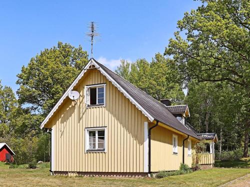 a yellow house with a gambrel roof at 7 person holiday home in LåNGARYD-By Traum in Långaryd