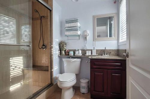 a bathroom with a toilet and a sink and a shower at Luxstay in Huntington Beach in Huntington Beach