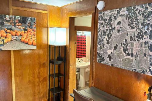 a room with a bathroom with a sink and a mirror at Julian Orchard Ranch in Santa Ysabel