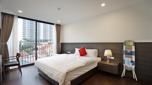 מיטה או מיטות בחדר ב-Luxe Paradise Residence 11 To Ngoc Van