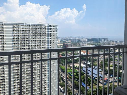 a view from the balcony of a tall building at Studio Condo Manila by the Bay Roxas Blvd near US Embassy in Manila