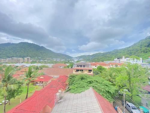 arial view of a city with buildings and trees at Shaka Guest House in Kata Beach