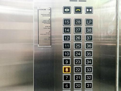 an elevator control panel with the numbers on it at Studio Condo Manila by the Bay Roxas Blvd near US Embassy in Manila